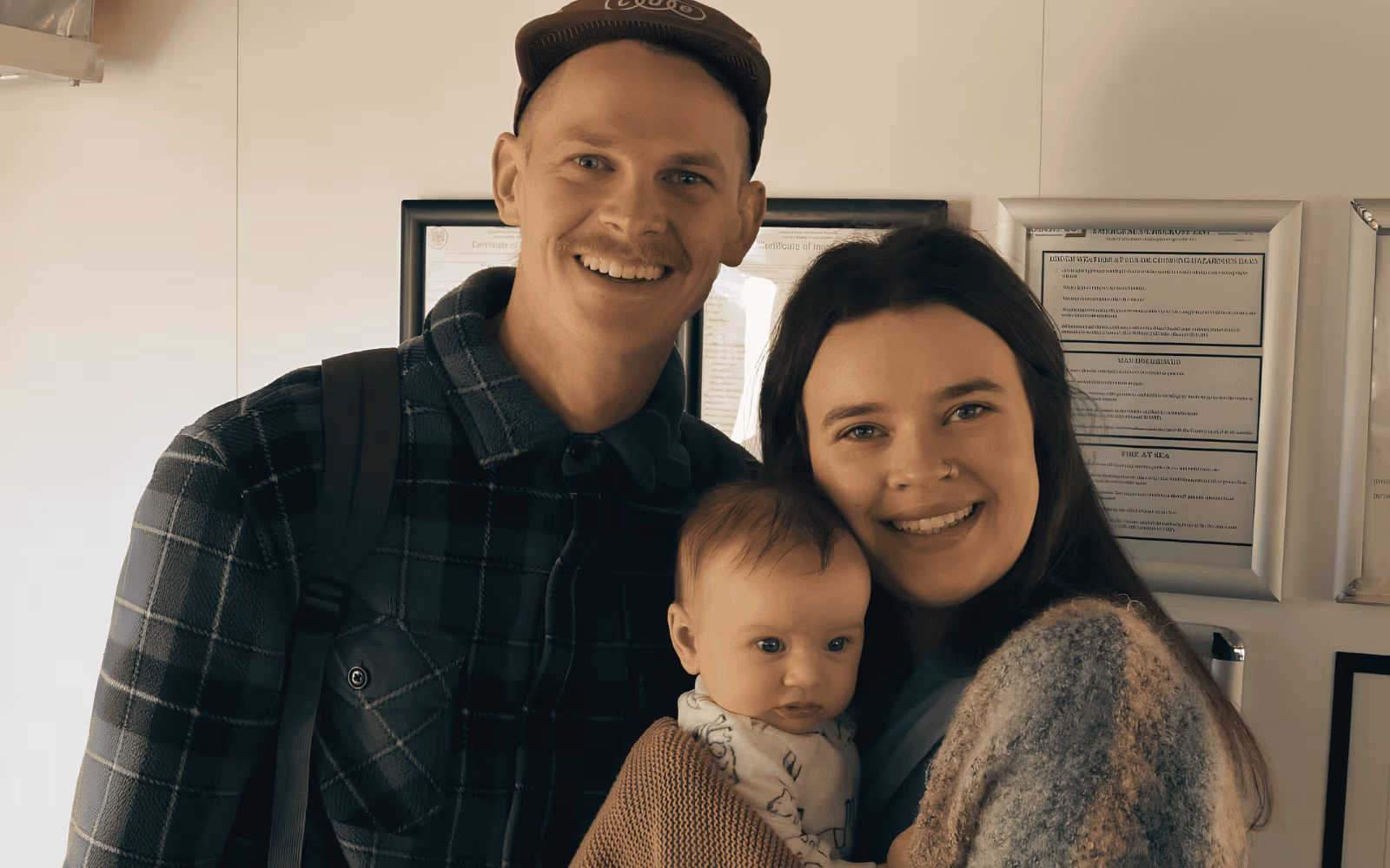 Reid and Mia Kislewski with their child